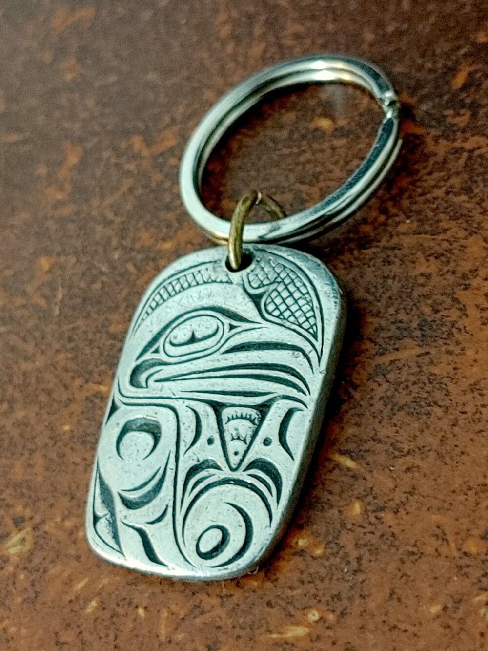 Indigenous engraved Frederick Pewter raven pendant